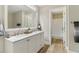 Elegant bathroom with double vanity, marble countertops, and stylish mirror at 7160 Royston Way, Cumming, GA 30028