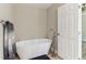 Modern bathroom with freestanding tub and stylish fixtures at 7160 Royston Way, Cumming, GA 30028