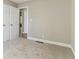 Bedroom featuring neutral walls, plush carpeting, and a double-door closet at 7160 Royston Way, Cumming, GA 30028