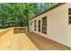 Inviting deck with natural wood finish and white siding, perfect for relaxing or entertaining outdoors at 7160 Royston Way, Cumming, GA 30028