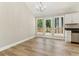 Charming dining area featuring hardwood floors, bright windows and access to the wooden outdoor deck at 7160 Royston Way, Cumming, GA 30028