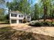 Charming two-story home with a two-car garage and beautiful landscaping at 7160 Royston Way, Cumming, GA 30028
