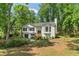 Two-story house with gray roof, gray siding, bay window, covered entrance, and an attached garage at 7160 Royston Way, Cumming, GA 30028