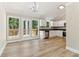 Modern kitchen and dining area with stainless steel appliances and backyard access at 7160 Royston Way, Cumming, GA 30028