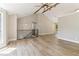 Spacious living area with high ceilings, wood floors, and staircase; ideal for entertaining and relaxation at 7160 Royston Way, Cumming, GA 30028