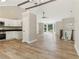 Open-concept living area with new flooring and abundant natural light at 7160 Royston Way, Cumming, GA 30028