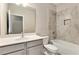 Bathroom featuring a shower and bath combination, and a light color palette at 305 Duval Dr, Alpharetta, GA 30009