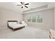 Spacious main bedroom with tray ceilings, large windows, and a ceiling fan at 305 Duval Dr, Alpharetta, GA 30009