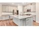 Modern kitchen with granite countertops, stainless steel appliances, and white cabinetry at 305 Duval Dr, Alpharetta, GA 30009