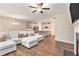 Open-concept living space leading to a modern kitchen and dining area with neutral tones at 305 Duval Dr, Alpharetta, GA 30009