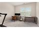 Home office featuring a desk area, natural light, and space for a treadmill at 305 Duval Dr, Alpharetta, GA 30009