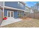 Home's outdoor patio with view of small yard and fence at 305 Duval Dr, Alpharetta, GA 30009