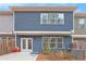 The rear exterior of the home shows a patio with lawn at 305 Duval Dr, Alpharetta, GA 30009