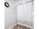 Bathroom with a white shower curtain and a clock on the wall at 400 Toronto Cir, Hampton, GA 30228