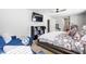 Comfortable bedroom with a cozy seating area, a large bed, and plenty of storage at 400 Toronto Cir, Hampton, GA 30228