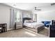 Sunlit bedroom featuring stylish furniture, neutral walls, and a comfortable seating area at 400 Toronto Cir, Hampton, GA 30228