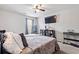 This bedroom includes carpet, ceiling fan, a flat screen TV, and a keyboard at 400 Toronto Cir, Hampton, GA 30228