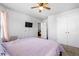 A bedroom featuring a mounted flat screen TV, and double closet at 400 Toronto Cir, Hampton, GA 30228