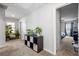 This hallway features plants, an storage unit, carpet, and leads to a bedroom at 400 Toronto Cir, Hampton, GA 30228