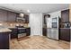 Well-lit kitchen featuring stainless steel appliances, stylish countertops, backsplash, and ample cabinetry at 400 Toronto Cir, Hampton, GA 30228