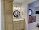 Bright bathroom features a vanity with storage, a decorative mirror, and access to the adjacent bedroom at 500 Bainbridge Dr, Atlanta, GA 30327