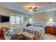 Serene bedroom features a cozy window seat, ceiling fan, and calm lighting for relaxing nights at 500 Bainbridge Dr, Atlanta, GA 30327
