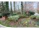 Entrance to Heritage Oaks, a community surrounded by beautiful trees and flowering plants at 500 Bainbridge Dr, Atlanta, GA 30327