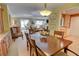Spacious dining room connecting to the living area; features classic decor and a wooden dining set at 500 Bainbridge Dr, Atlanta, GA 30327