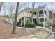 Exterior angle view of a two-story condo with stairs leading to the second floor at 500 Bainbridge Dr, Atlanta, GA 30327