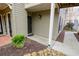 Home's entrance with a black door, a potted fern, and a stone walkway at 500 Bainbridge Dr, Atlanta, GA 30327