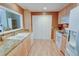 Well-lit kitchen features light wood cabinets, granite countertops, and a pantry for ample storage at 500 Bainbridge Dr, Atlanta, GA 30327