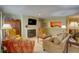 Spacious living room featuring a fireplace, TV, and comfortable seating at 500 Bainbridge Dr, Atlanta, GA 30327