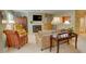Comfortable living room featuring a fireplace, TV, and cozy armchairs at 500 Bainbridge Dr, Atlanta, GA 30327