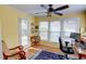 Bright home office with ample natural light, ceiling fan, and a functional desk setup at 500 Bainbridge Dr, Atlanta, GA 30327