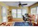 Bright home office with ample natural light, ceiling fan, and a functional desk setup at 500 Bainbridge Dr, Atlanta, GA 30327