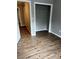 Bedroom boasts new flooring and walk-in closet with wire shelving at 9866 Point View Dr, Jonesboro, GA 30238