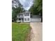Charming two-story home features a well-manicured lawn and attached two car garage at 9866 Point View Dr, Jonesboro, GA 30238