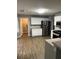Open concept kitchen featuring stainless steel appliances and modern fixtures at 9866 Point View Dr, Jonesboro, GA 30238