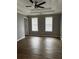 Spacious main bedroom featuring new flooring, natural light, and tray ceiling at 9866 Point View Dr, Jonesboro, GA 30238