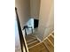 Staircase with modern flooring leading to the front entry and upper floors at 9866 Point View Dr, Jonesboro, GA 30238