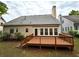 Spacious wooden deck in the backyard, perfect for entertaining and enjoying the outdoors and a chimney on the house at 4481 Mccart Cv, Stone Mountain, GA 30083