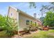 This home features a wooden deck, and a backyard with mature trees and greenery at 4481 Mccart Cv, Stone Mountain, GA 30083
