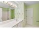Bathroom featuring green walls, a large mirror and white countertop at 4481 Mccart Cv, Stone Mountain, GA 30083