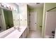 Bathroom featuring tile floors, a sink, and a bathtub at 4481 Mccart Cv, Stone Mountain, GA 30083