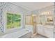 En-suite bathroom with garden tub, enclosed shower, and double vanity at 4481 Mccart Cv, Stone Mountain, GA 30083