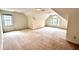 Spacious carpeted bedroom with attic ceiling and dormer window at 4481 Mccart Cv, Stone Mountain, GA 30083