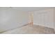 Bedroom featuring patterned walls, carpeted floors and closet at 4481 Mccart Cv, Stone Mountain, GA 30083