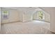 Spacious carpeted bedroom illuminated by natural light from multiple windows at 4481 Mccart Cv, Stone Mountain, GA 30083