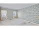 Spacious bedroom with floral wallpaper, carpeted, and with natural light at 4481 Mccart Cv, Stone Mountain, GA 30083