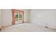 Bright and airy bedroom with a large window and neutral colored carpet and walls at 4481 Mccart Cv, Stone Mountain, GA 30083